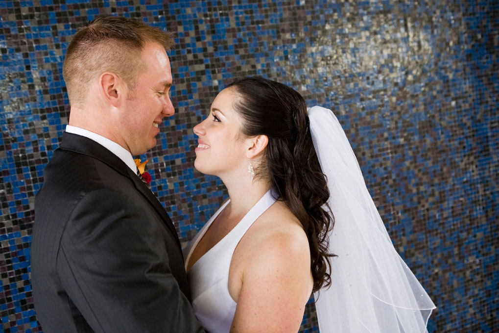 couple and mosaic wall at SFU wedding at the Diamond Alumni Centre