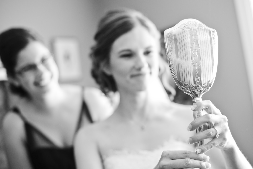 bride looking in grandmother's mirror, chilliwack wedding