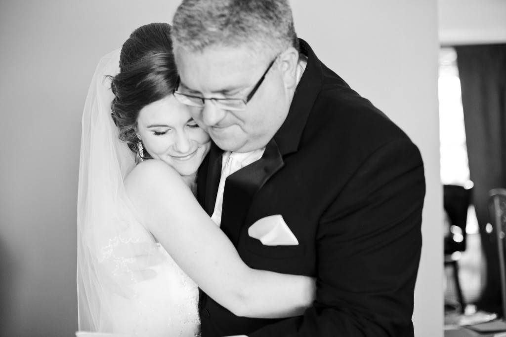 bride and father hug