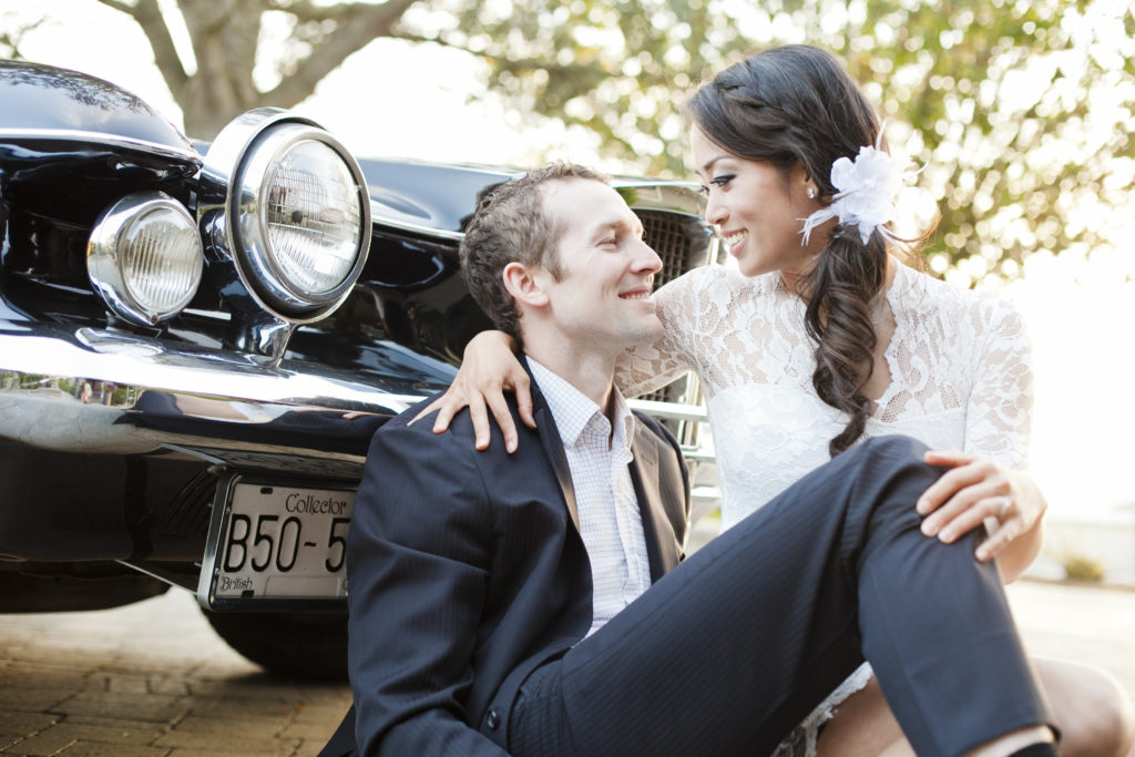 couple with vintage collector car