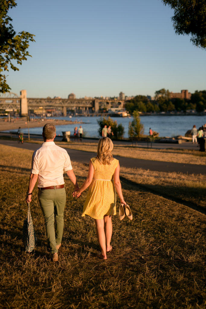 couple walking at english bay sunset