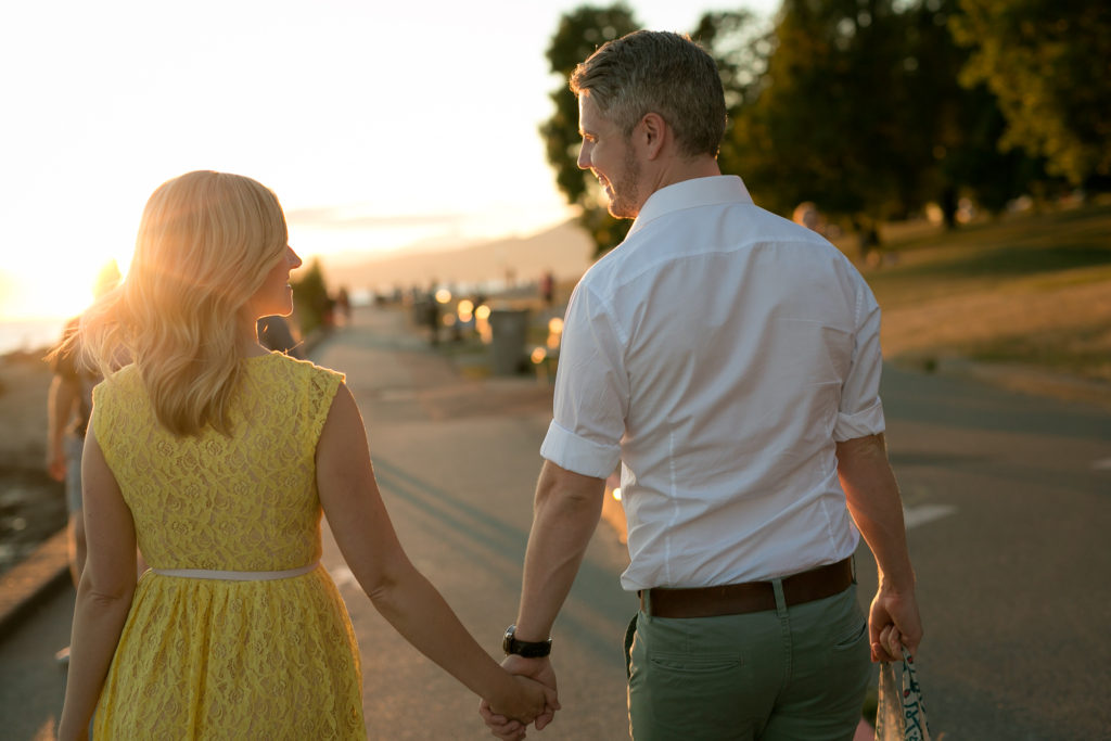 walking couple english bay engagement at sunset