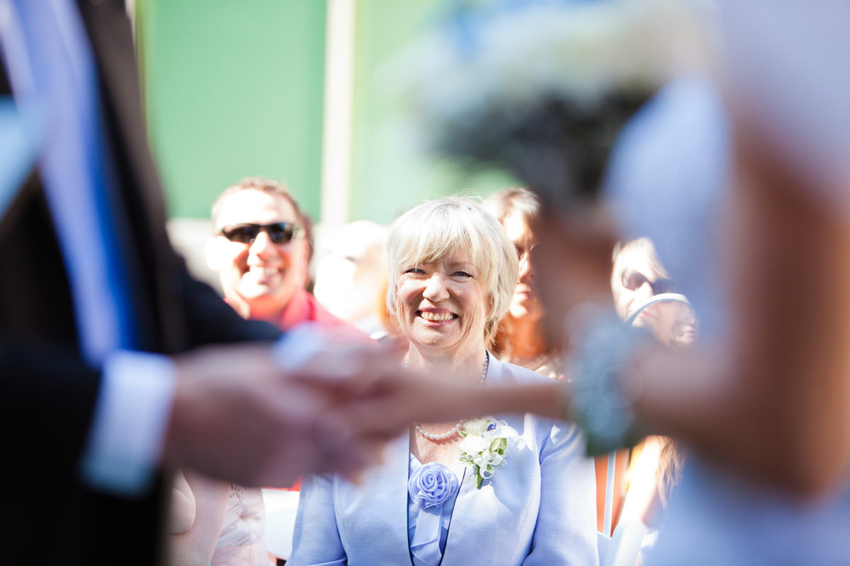 mother of the groom watching wedding ceremony