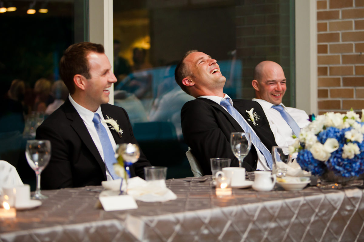 groomsmen laughing at wedding reception port moody