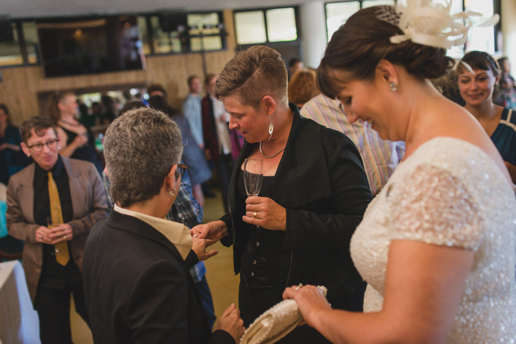 showing off wedding rings after wedding ceremony