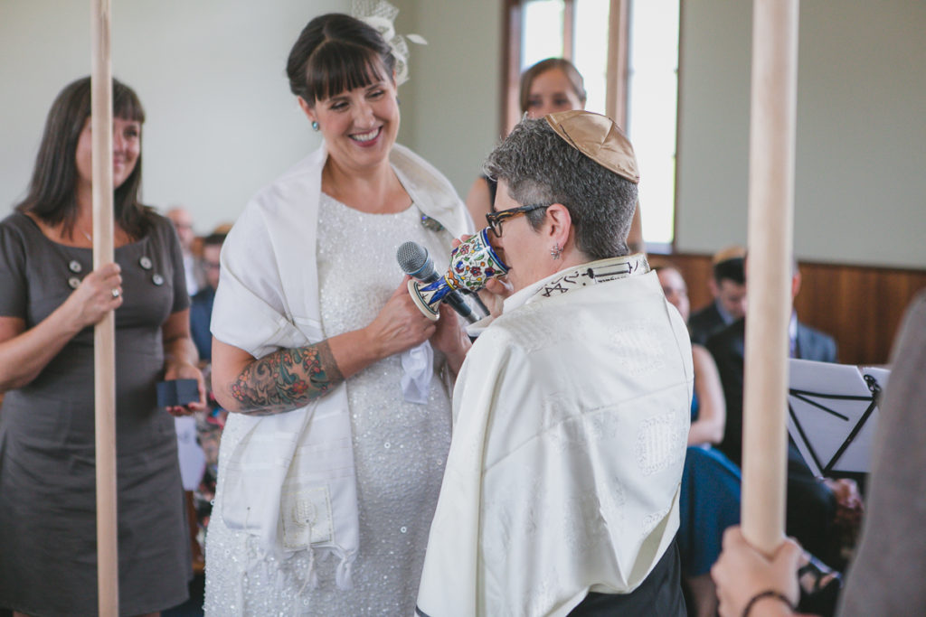 drinking wine for betrothal blessings at jewish wedding ceremony vancouver