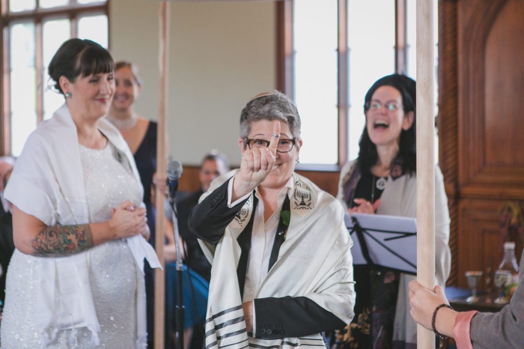 bride showing off ring at jewish wedding ceremony vancouver