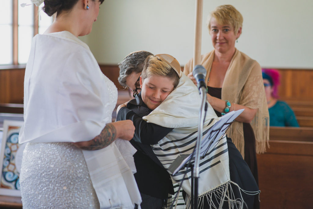 hug with son during same-sex wedding ceremony vancouver