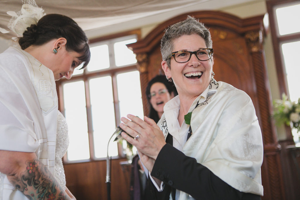 happy couple during ceremony, same-sex wedding vancouver