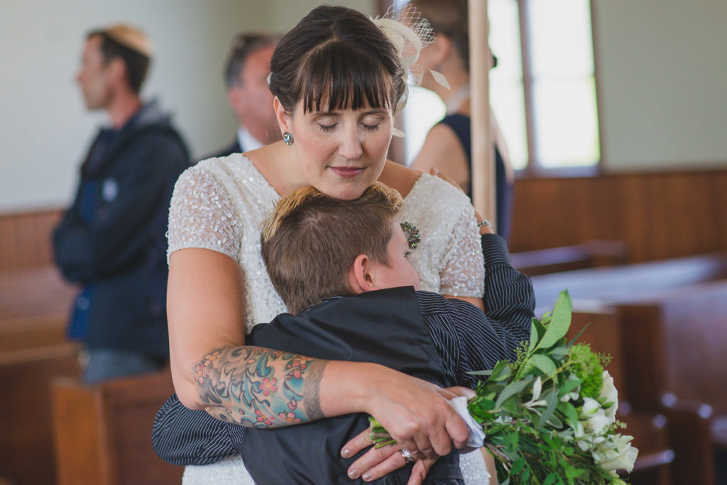 hug with son after same-sex wedding ceremony vancouver