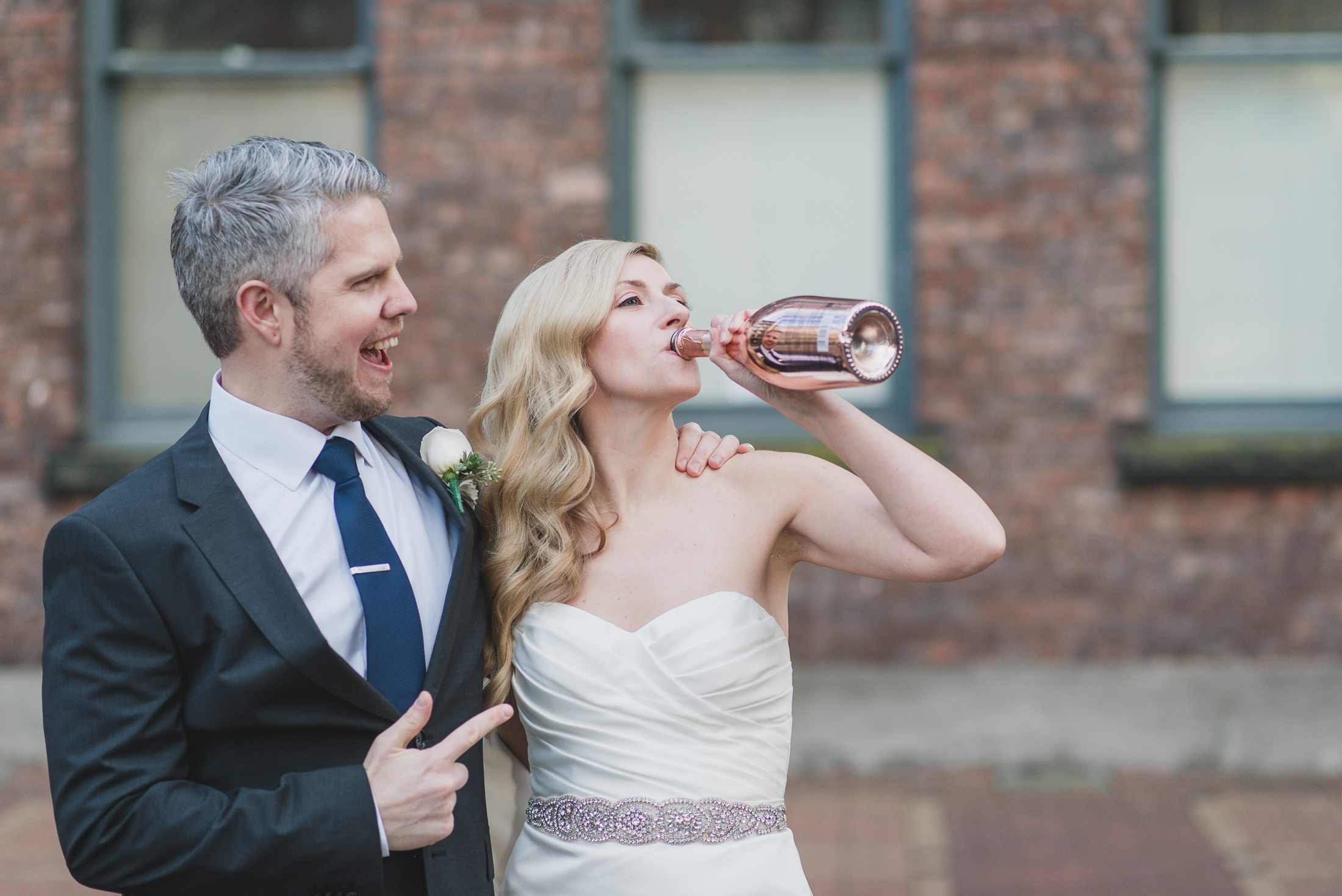 bride drinking champagne wedding photos