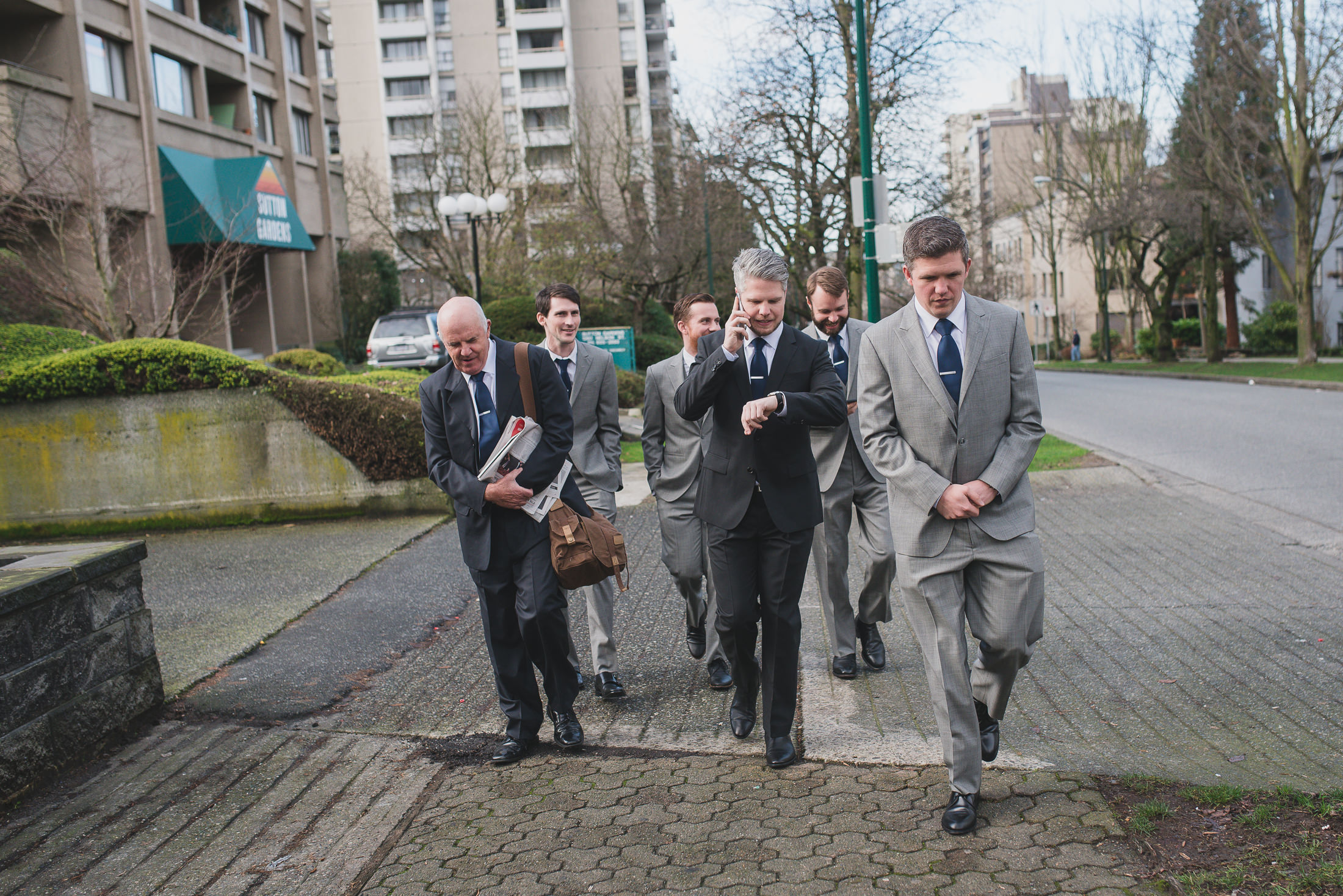 groom and groomsmen walking to vancouver wedding