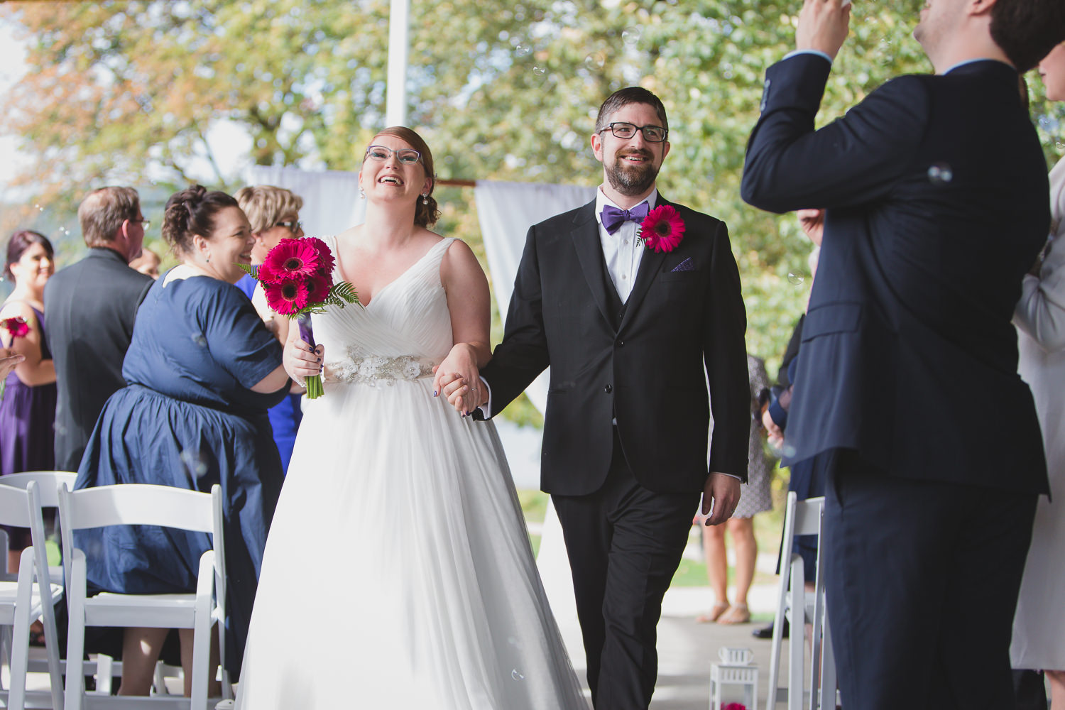 Wedding ceremony exit at Rocky Point Park beer themed wedding by Port Moody wedding Photographer Wink Photography