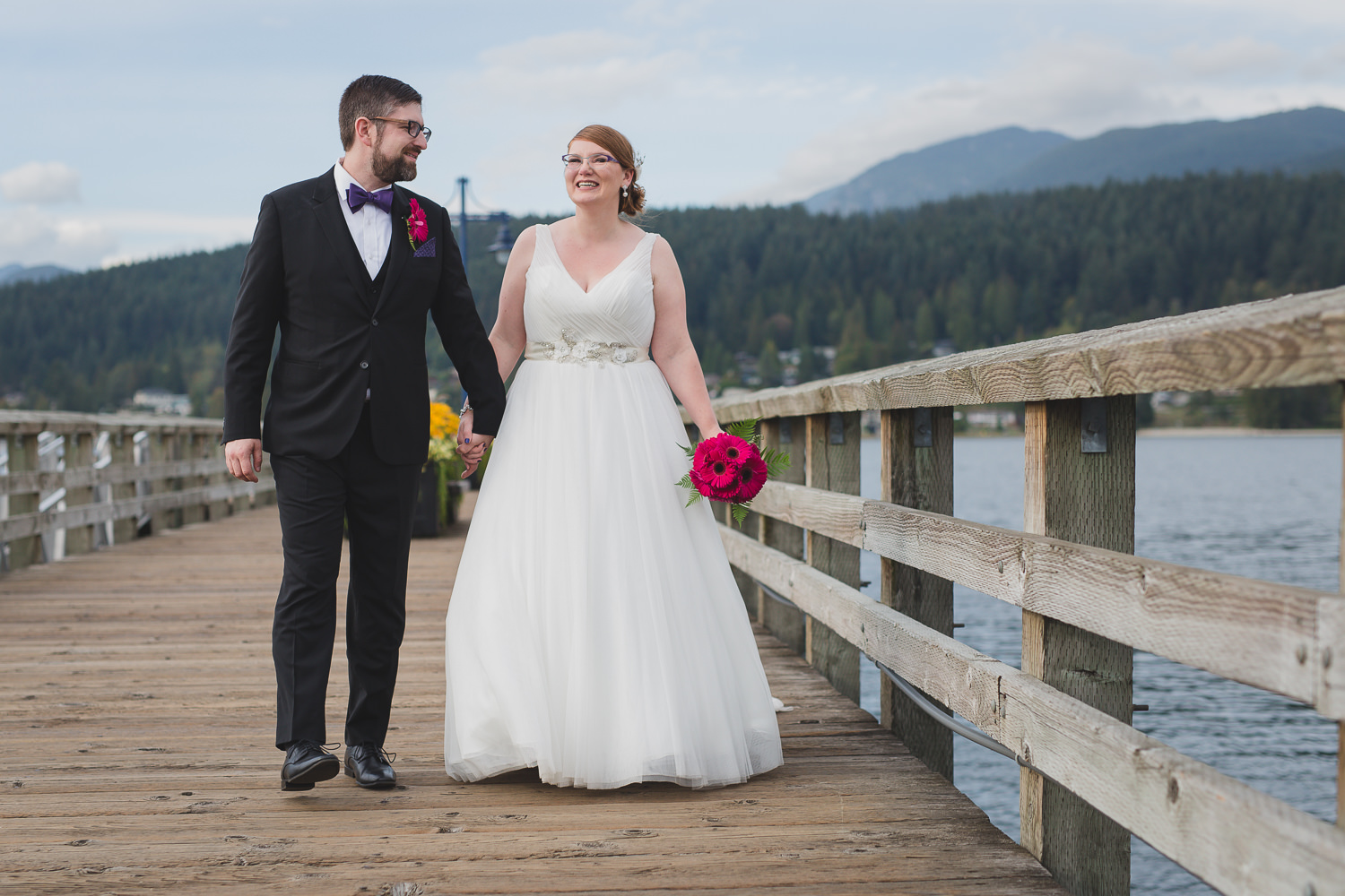 Bride and groom at Rocky Point Park wedding, walking on the dock, by Port Moody wedding photographer