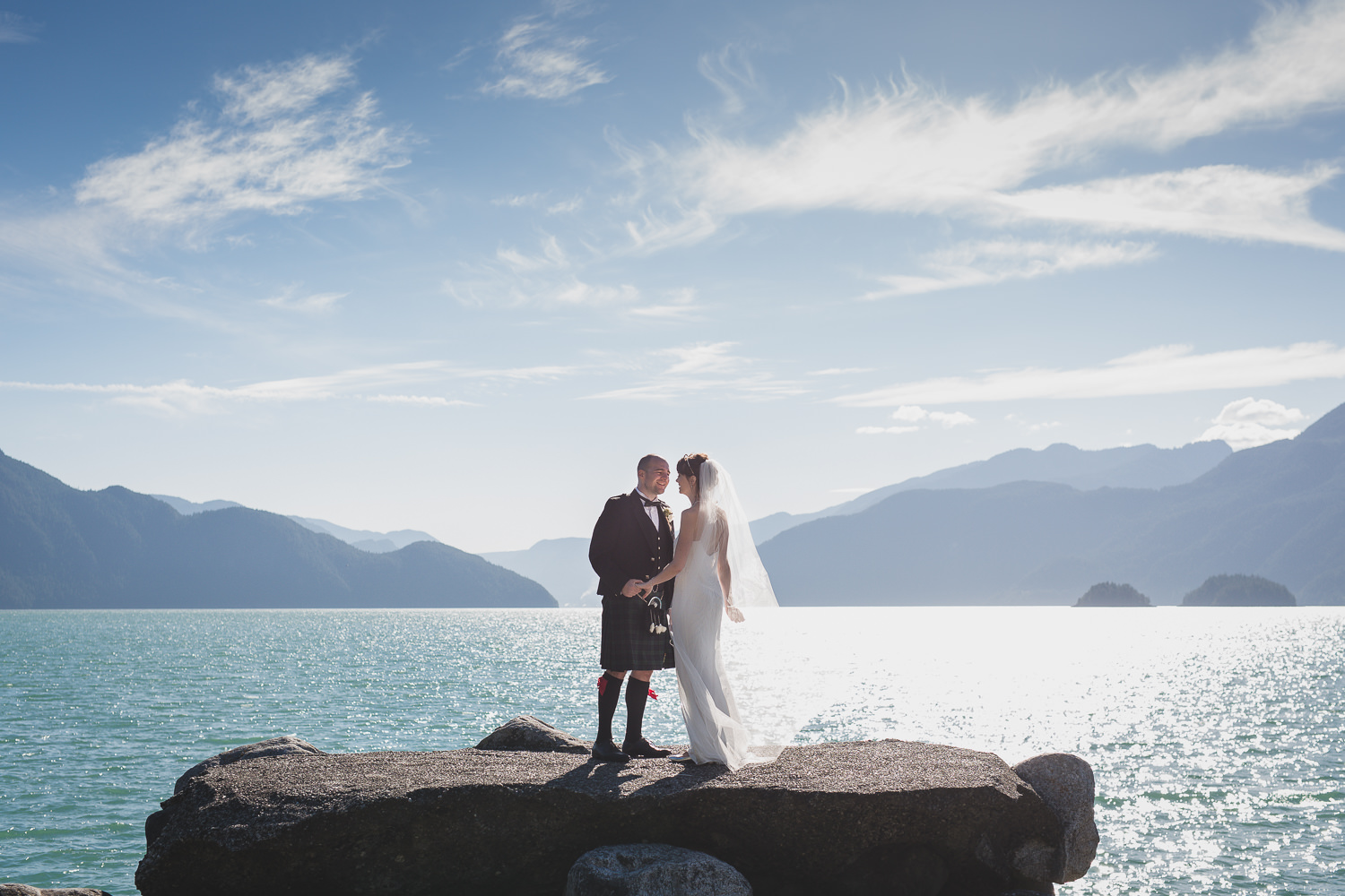 Alternative wedding couple on rocks at Furry Creek Squamish wedding