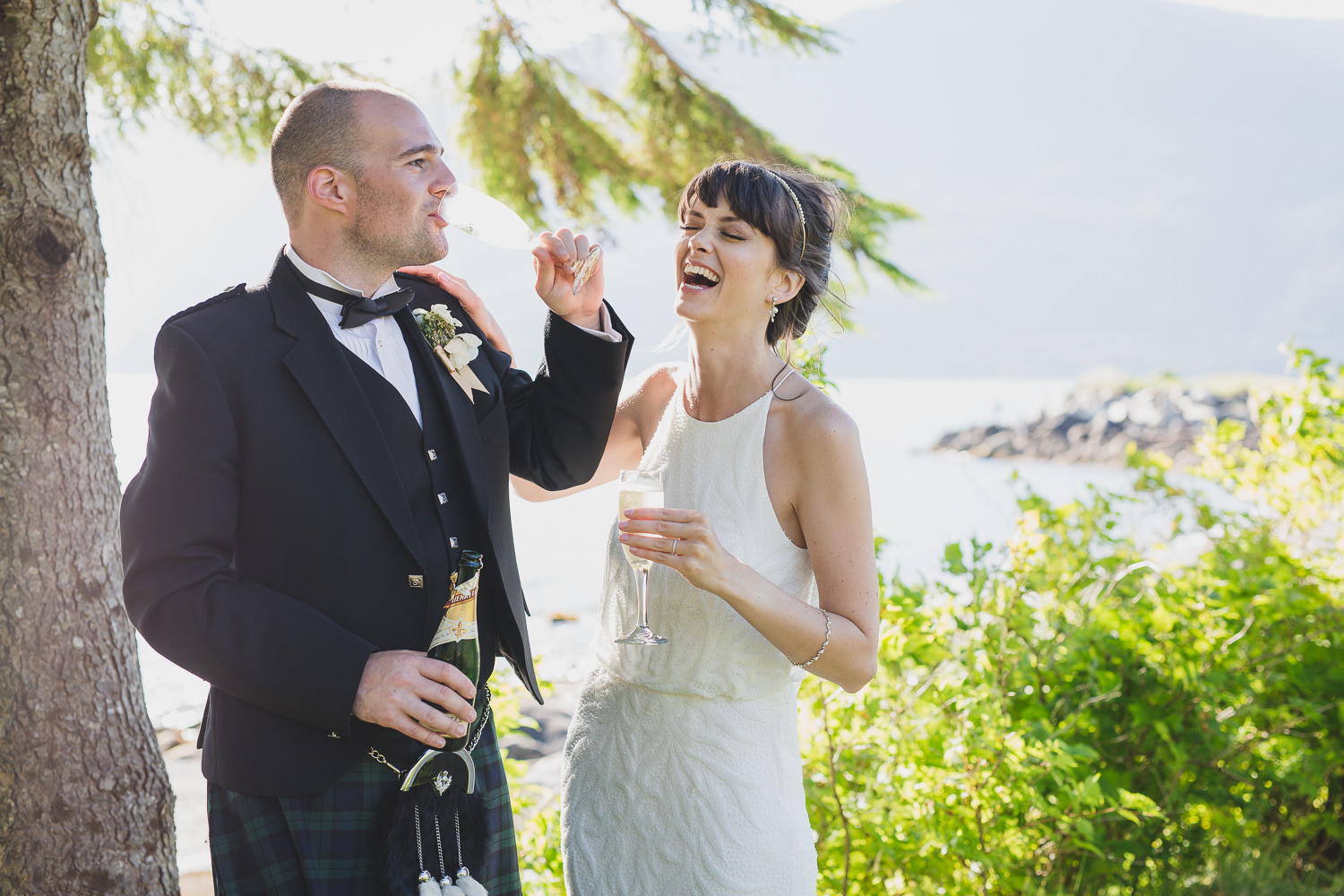 bride and groom with champagne having fun at Squamish wedding