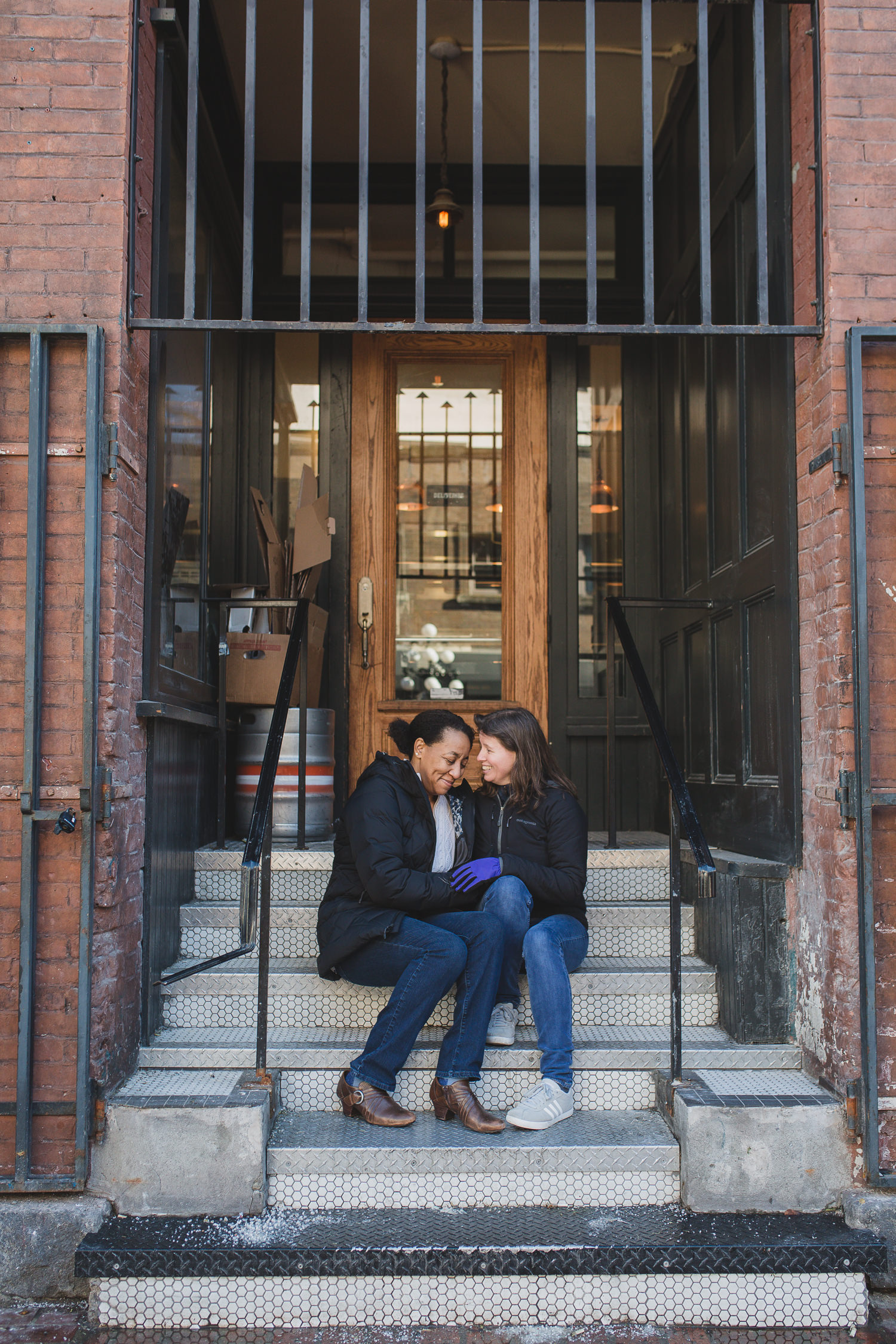 lesbian couple on steps in gastown