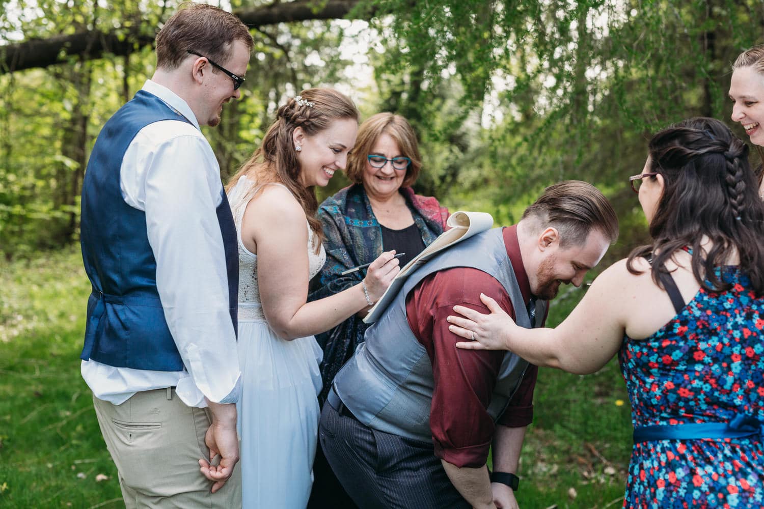 campbell valley park elopement signing on friend's back