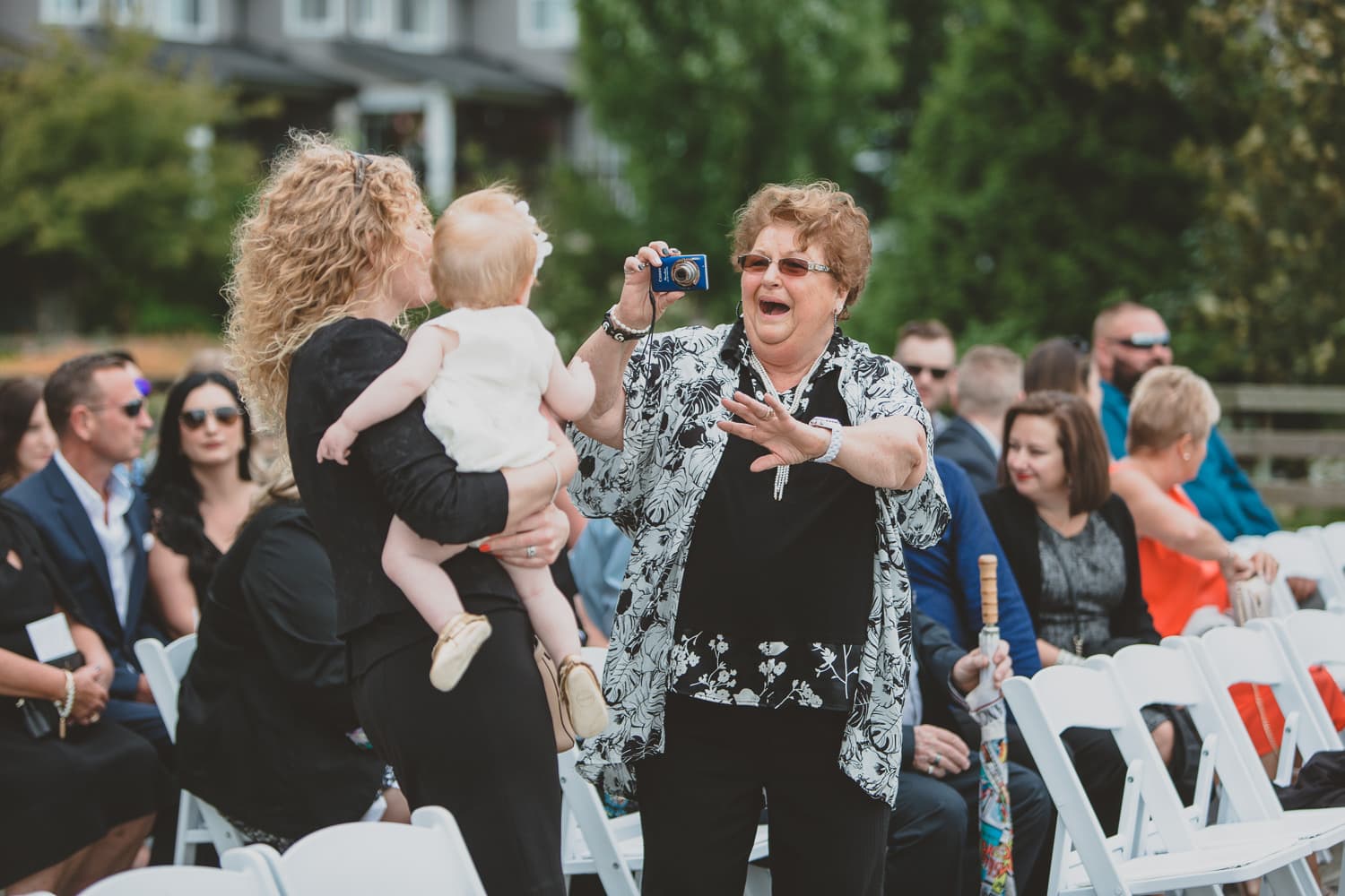 guests at wedding ceremony on dock in osprey village pitt meadows