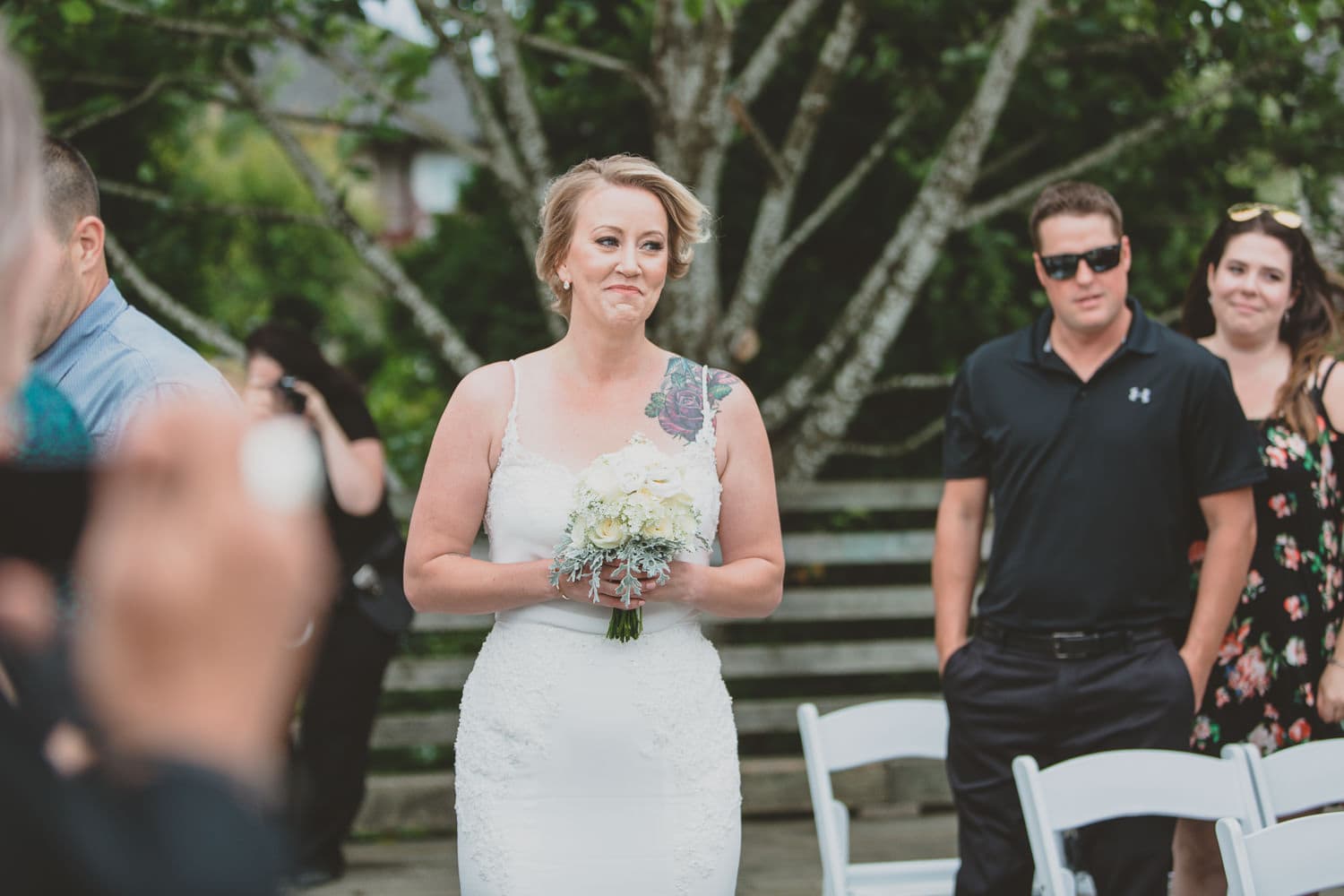 bride coming down the aisle on dock in Osprey Village