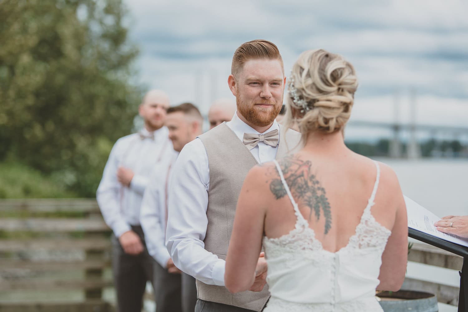 couple getting married outside on dock in Osprey Village Pitt Meadows
