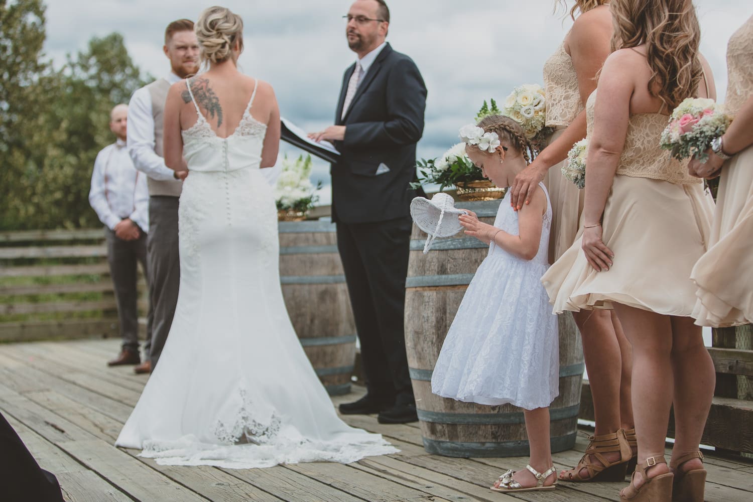 flower girl dumping out basket at wedding ceremony