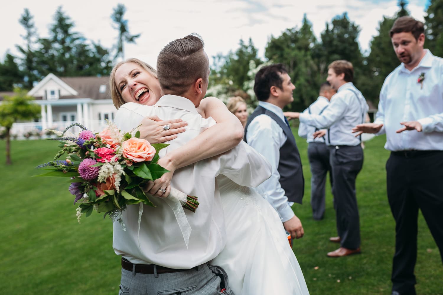 fun hug moment at heronsbridge wedding in abbotsford