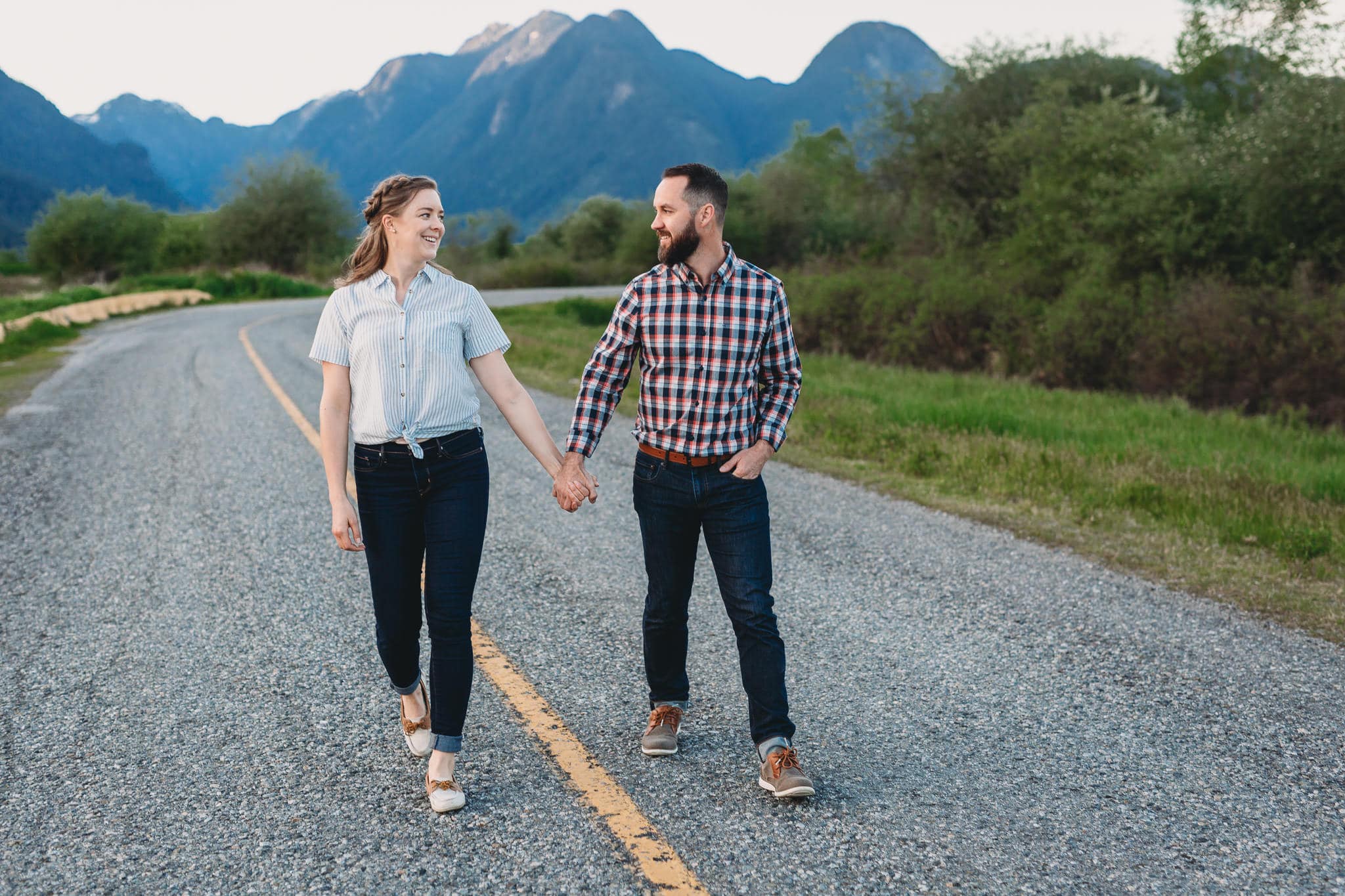 couple walking down the road in pitt meadows at their engagement session