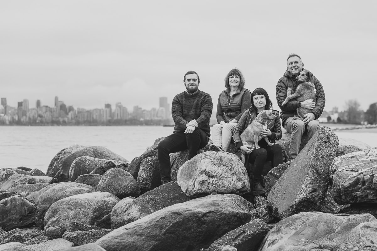 family photo session with dogs and adult kids at spanish banks beach vancouver