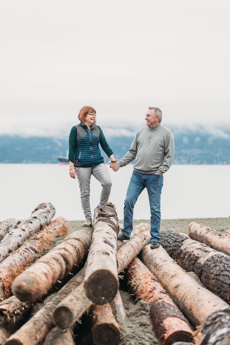 fun winter beach photo shoot in vancouver with older couple with adult kids