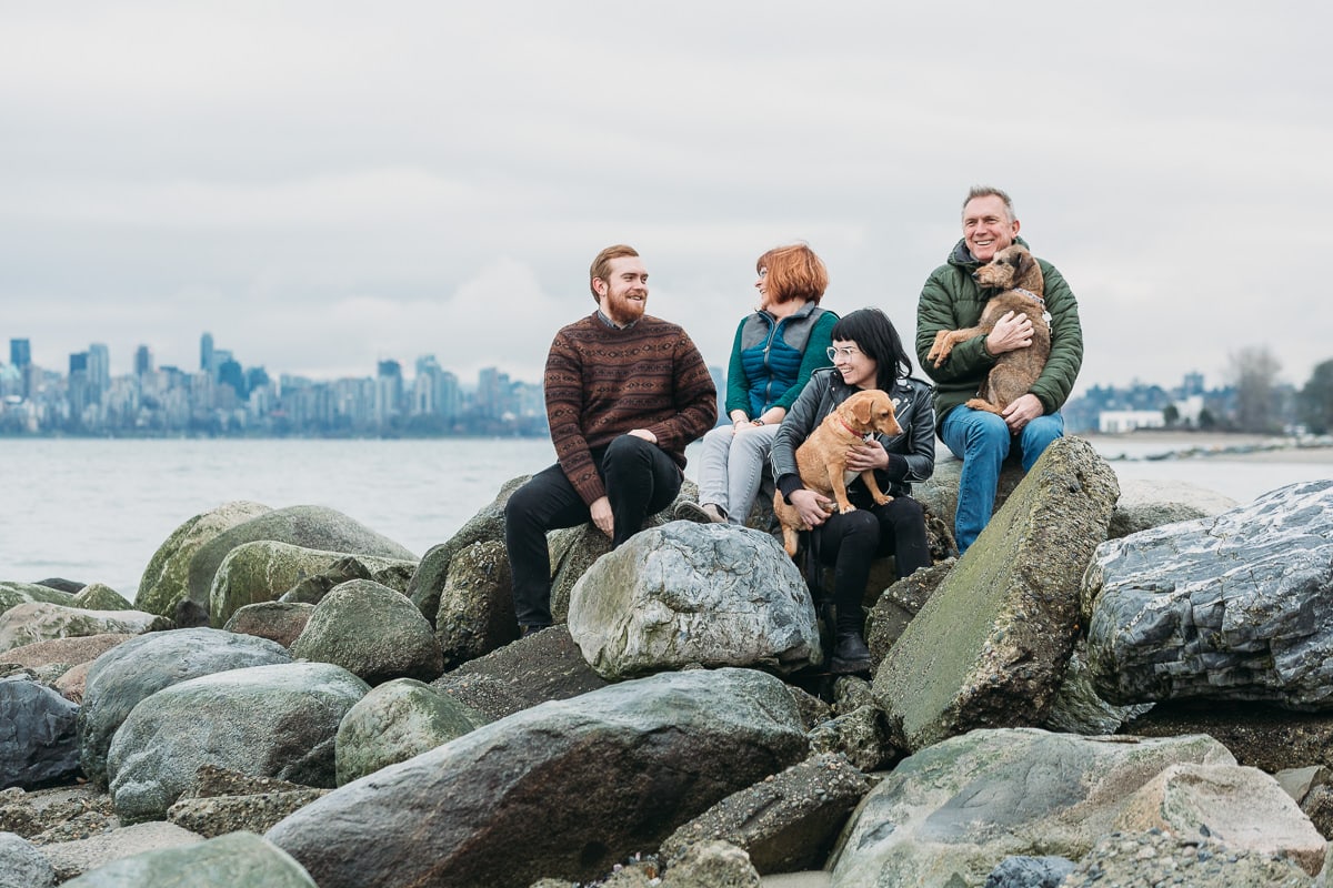 candid family beach photos in vancouver