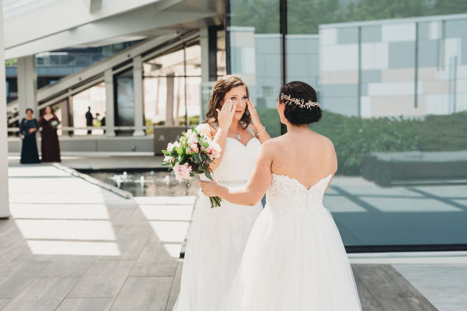 two brides first look at lgbtq wedding at parq hotel rooftop