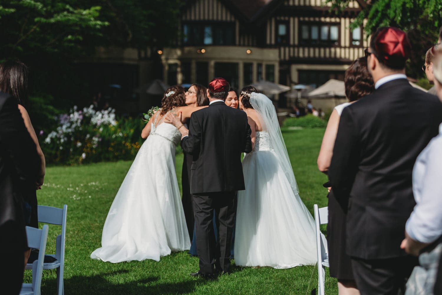 two brides entering wedding ceremony at lgbtq wedding at hart house vancouver