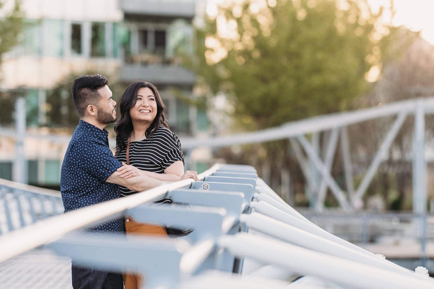 couple on bridge in olympic village at False Creek Vancouver