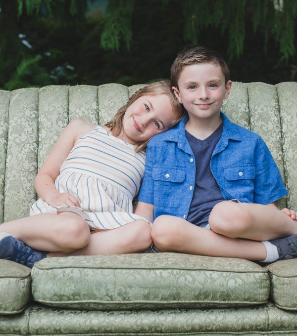 brother and sister on vintage couch in fraser valley farm mini session